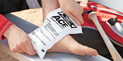 Using an ACE Instant Cold Compress on foot.