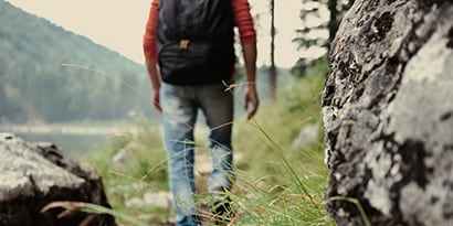 Hiker walking through the mountains.